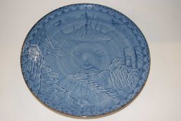 A Japanese porcelain dish with a blue and white landscape design, 31cm diameter