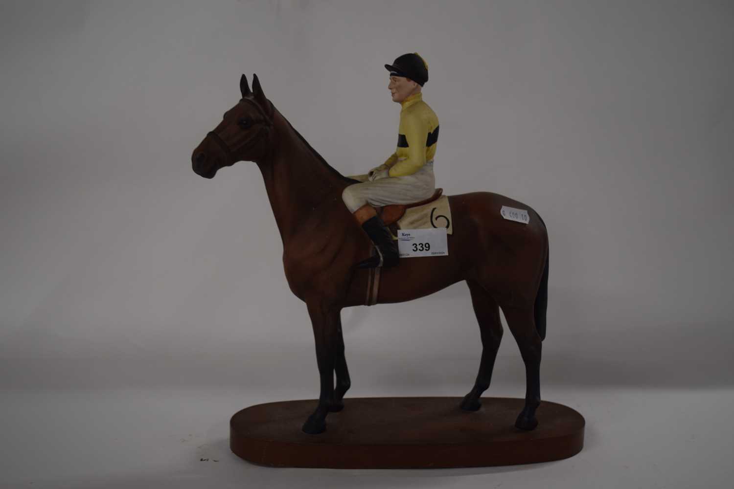 A Beswick horse model of Arkle with Pat Taaffe up, underside of horse with factory mark and title