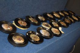 A collection of late 19th Century pot lids in black wooden frames, all with typical designs