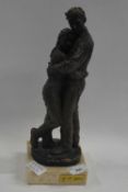 A bronze figure of a young couple by J M Belsa on a marble base, H. 30cm.