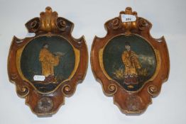 Two wooden shields with painted Chinese figures, 27cm high