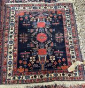 An Afshar wool rug with geometric patterns in blue, 150 x 135cm (Item 47 on vendor list)