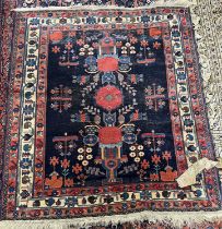 An Afshar wool rug with geometric patterns in blue, 150 x 135cm (Item 47 on vendor list)