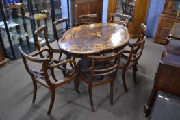 Irish Killarney yew wood breakfast table with shaped top inlaid with various scenes of houses,