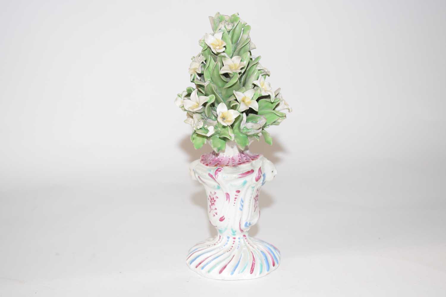A Bow porcelain vase of flowers decorated in typical colours, 16cm high