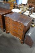 Georgian mahogany serpentine front four drawer chest with brass swan neck handles and raised on