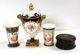 A Wedgwood vase and cover, the central panel painted with flowers, the cover with gilt acorn knop,