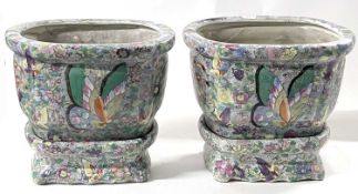 Two Chinese porcelain planters and stands, 19th Century with a tobacco leaf and butterfly type