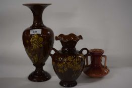 A group of Linthorpe pottery wares including a baluster vase, with floral decoration, factory mark