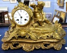 A late 19th Century gilt brass clock, the white enamel dial marked RRY Marc Paris, the clock