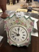 A small early 19th Century Dutch wall clock with floral decorated porcelain dial and a movement