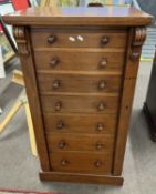 A Victorian mahogany Wellington type chest of typical form fitted with seven drawers with knob