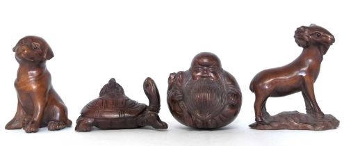 Four Netsuke carved animal figures, modelled as a Ram, a tortoise, a dog and a Buddha.
