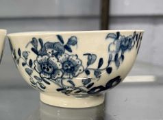A Lowestoft porcelain tea bowl circa 1770 with blue and white design trailing flowers