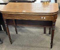 A Victorian mahogany D shape tea table with folding top raised on turned legs (Item 34 on vendor