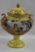 A continental porcelain vase and cover with a large printed panel of a pastoral scene, the yellow