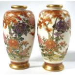A pair of Japanese Satsuma wear vases of baluster form, one marked "Fine Satsuma China", the other