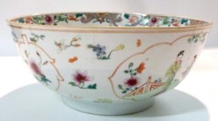 A large 18th Century Chinese porcelain punch bowl decorated with Chinese figures (riveted repair),