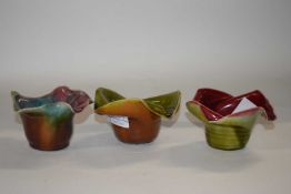 A group of three Linthorpe pottery vases or posie bowls, shape number 374