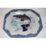 A large Highland stone ware dish painted with a leaping salmon within wavy blue and green borders,