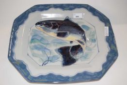 A large Highland stone ware dish painted with a leaping salmon within wavy blue and green borders,