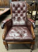 A Victorian rosewood and oxblood leather button back gents library type armchair with scrolled arm