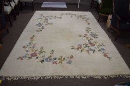 20th Century wool floor rug decorated with floral sprays on a cream background, 300 x 220 cm