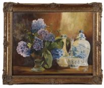 British School, 20th century, Still life with lilac flowers and blueware, oil on board, indistinctly