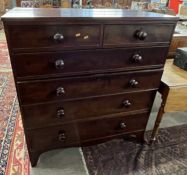 A Victorian dark mahogany chest of two short over four long drawers fitted with turned knob handles,