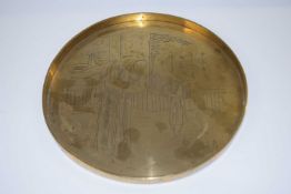 A Chinese brass tray decorated with Chinese figures in garden setting, 29cm diameter