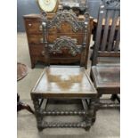 A 19th Century Yorkshire hard seated chair with shaped and carved back