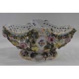 A late 19th Century continental porcelain basket with applied floral decoration, probably