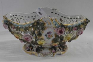 A late 19th Century continental porcelain basket with applied floral decoration, probably
