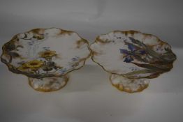 A pair of Doulton Burslem Spanish pattern tazzae with floral designs and retailers stamp for