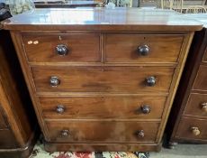 A Victorian mahogany chest of two short over three long drawers with turned knob handles, 105cm wide