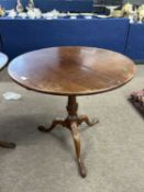 A Georgian mahogany circular top pedestal table with turned column and tripod base, top 78cm