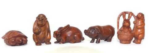 5 Netsuke carved animal figures, modelled as a monkey, a tortoise, rabbits, a hare and a pig