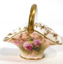 A small Royal Doulton basket painted with roses and signed M Cooper