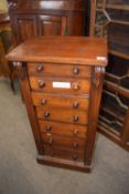 A Victorian mahogany Wellington type chest of typical form with seven drawers, turned knob
