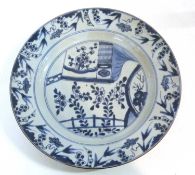 An 18th Century Chinese porcelain dish with blue and white design within brown line rim (