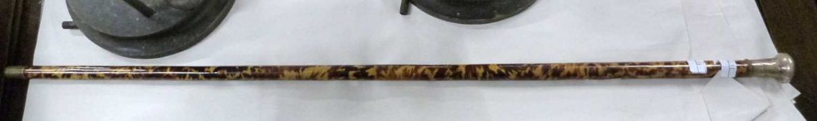 A tortoiseshell and white metal topped walking cane, 88cm long
