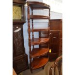 A large Victorian style mahogany corner what not or shelf with six shelves with turned side