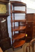 A large Victorian style mahogany corner what not or shelf with six shelves with turned side