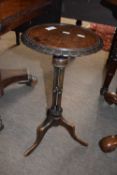 A small mahogany wine table with circular top, pierced column and tripod base, 56cm high
