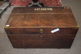 A Victorian military oak blanket box with brass bindings and side handles, the hinged lid opening to