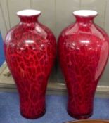 A large pair of Art Glass vases of baluster shape, the ruby ground with a coloured red design,