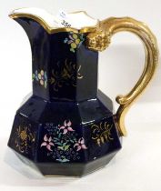 A 19th Century Spode jug with biting snake handle, the blue ground with painted floral decoration,