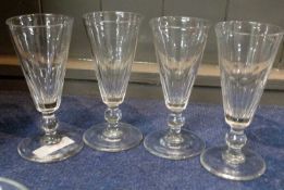 A set of four 19th Century champagne glasses with knopped stems