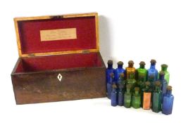 19th Century mahogany apothecary box set with a graduated group of coloured bottles, the interior