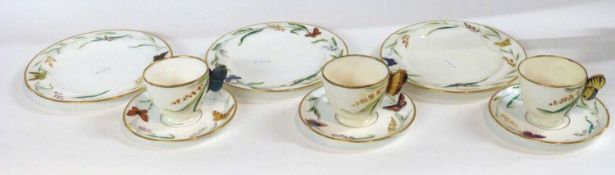 Group of 19th Century cups and saucers and plates, possibly Minton, the cups with butterfly
